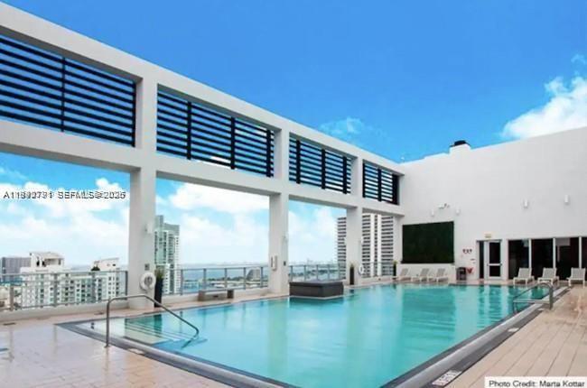 151 Southeast 1st Street, Unit 3111 Miami, FL 33131 - Photo 17 of 35 a view of swimming pool with seating area