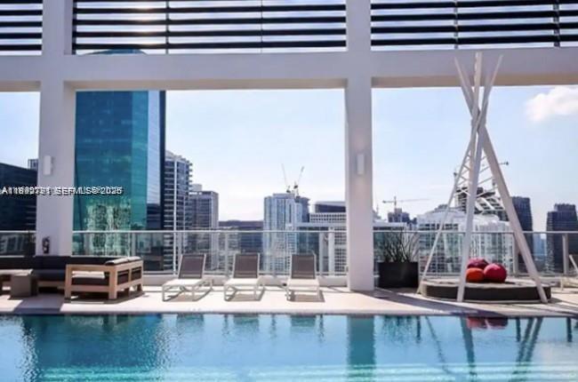 151 Southeast 1st Street, Unit 3111 Miami, FL 33131 - Photo 19 of 35 a view of swimming pool with outdoor seating