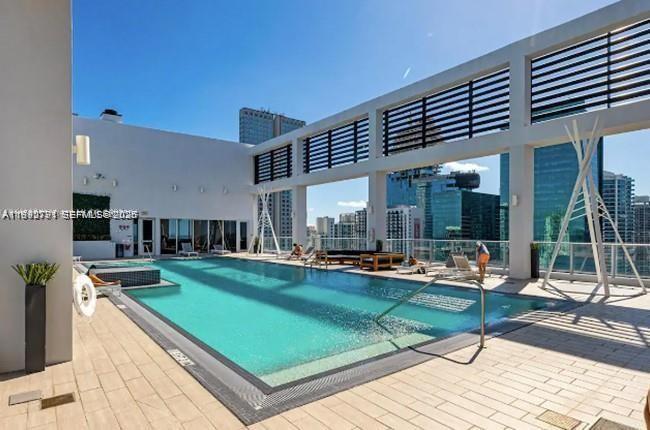 151 Southeast 1st Street, Unit 3111 Miami, FL 33131 - Photo 20 of 35 a view of a patio with chairs and tables