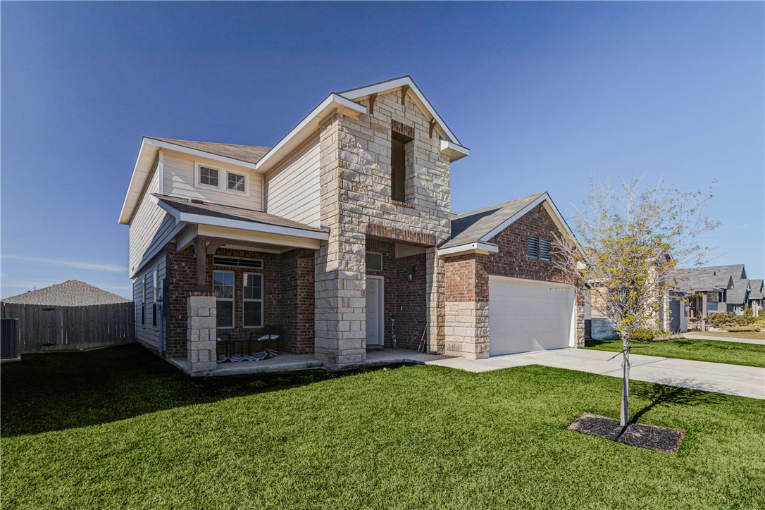 2176 Chief Street Bryan, TX 77807 - Photo 1 of 21 a front view of a house with garden
