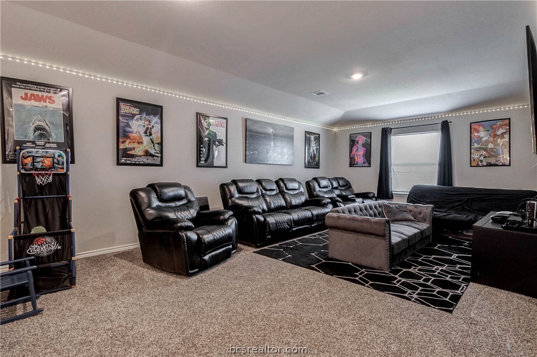 2176 Chief Street Bryan, TX 77807 - Photo 14 of 21 a living room with furniture a couch and dresser