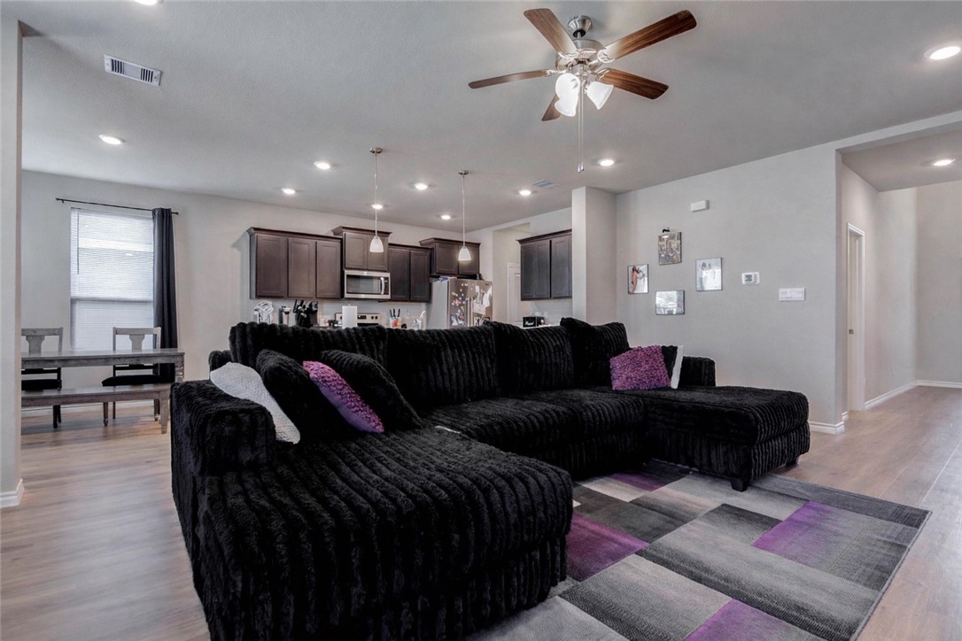2176 Chief Street Bryan, TX 77807 - Photo 5 of 21 a living room with furniture and a chandelier