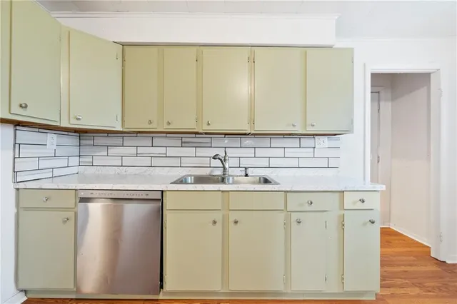 a kitchen with white cabinets