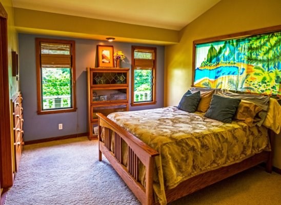 6280 Kalama Road Kapaa, HI 96746 - Photo 12 of 25 a bed sitting in a bedroom next to a window