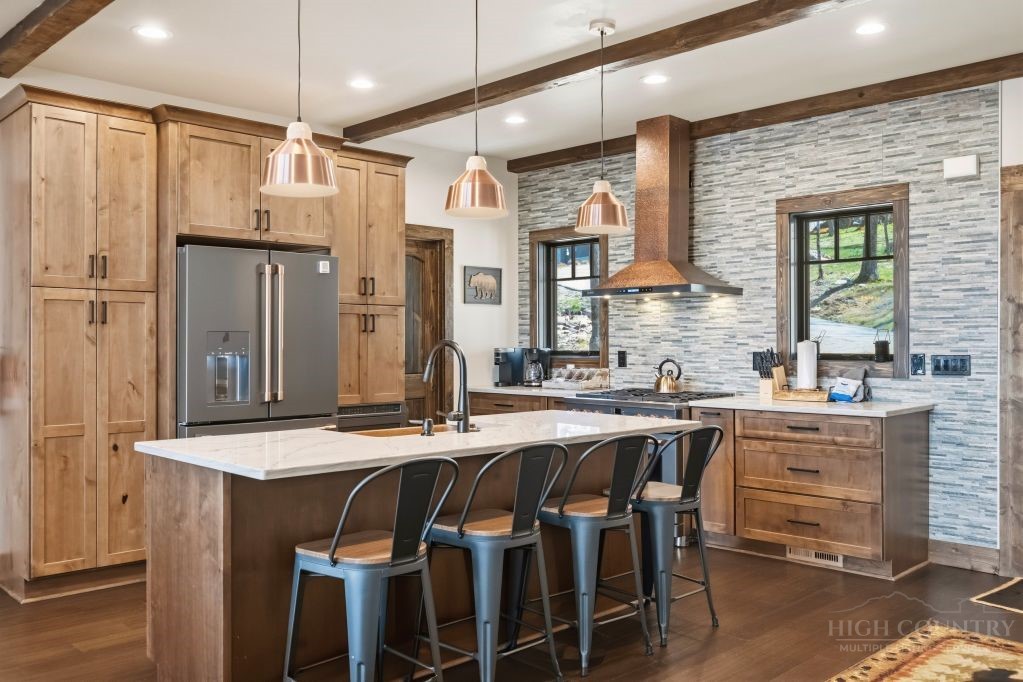 27 Timber Rock Trail Banner Elk, NC 28604 - Photo 11 of 50 a kitchen with kitchen island granite countertop a table chairs sink and refrigerator