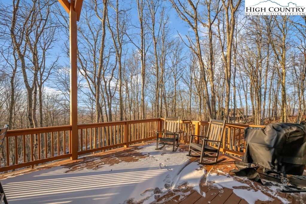 27 Timber Rock Trail Banner Elk, NC 28604 - Photo 16 of 45 a view of balcony with couch and wooden fence