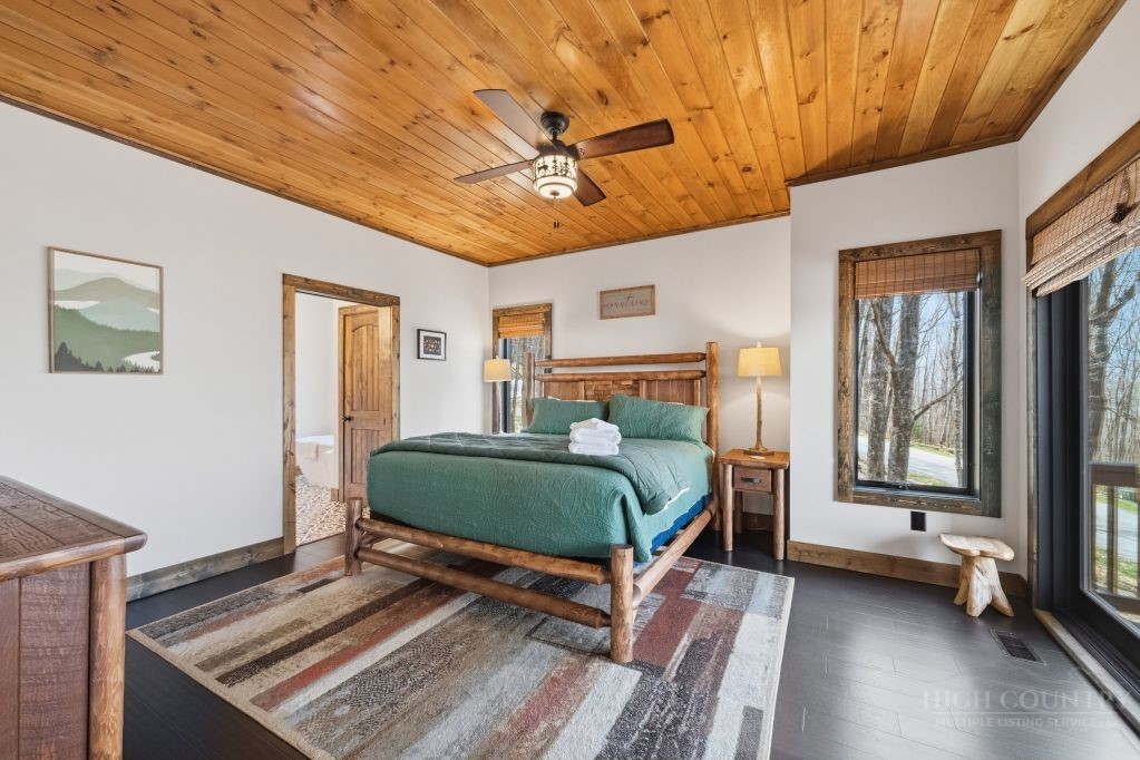 27 Timber Rock Trail Banner Elk, NC 28604 - Photo 21 of 50 a bedroom with a bed and wooden floor