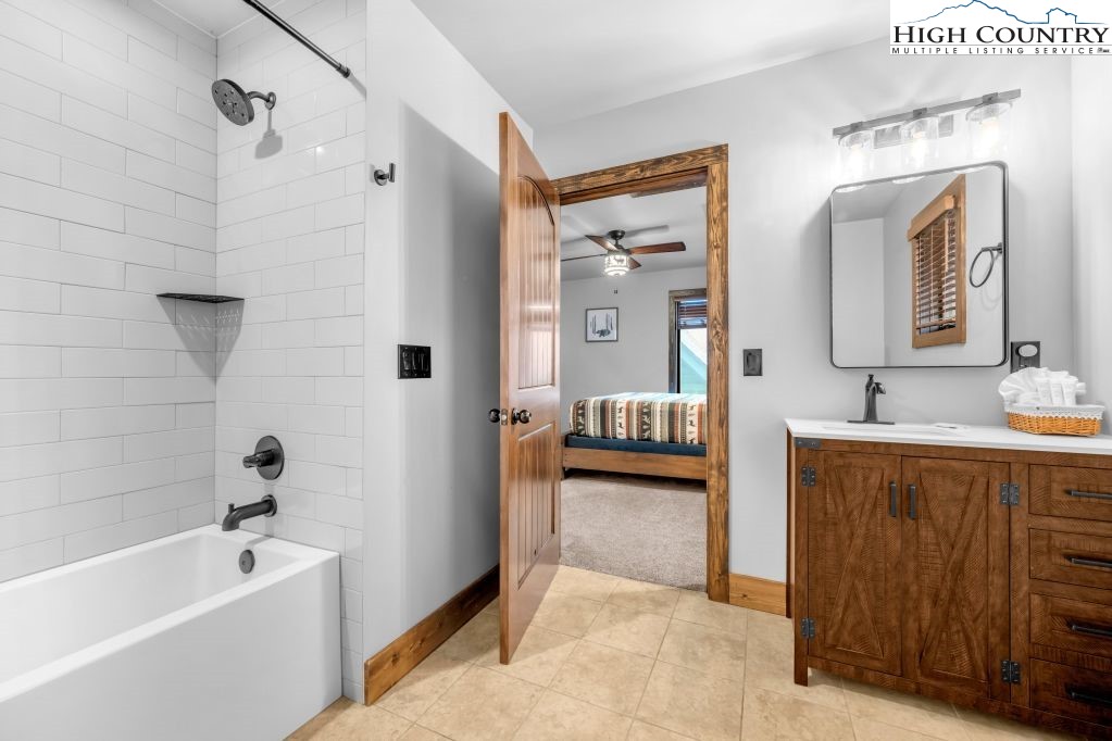27 Timber Rock Trail Banner Elk, NC 28604 - Photo 29 of 45 a spacious bathroom with a tub sink and mirror