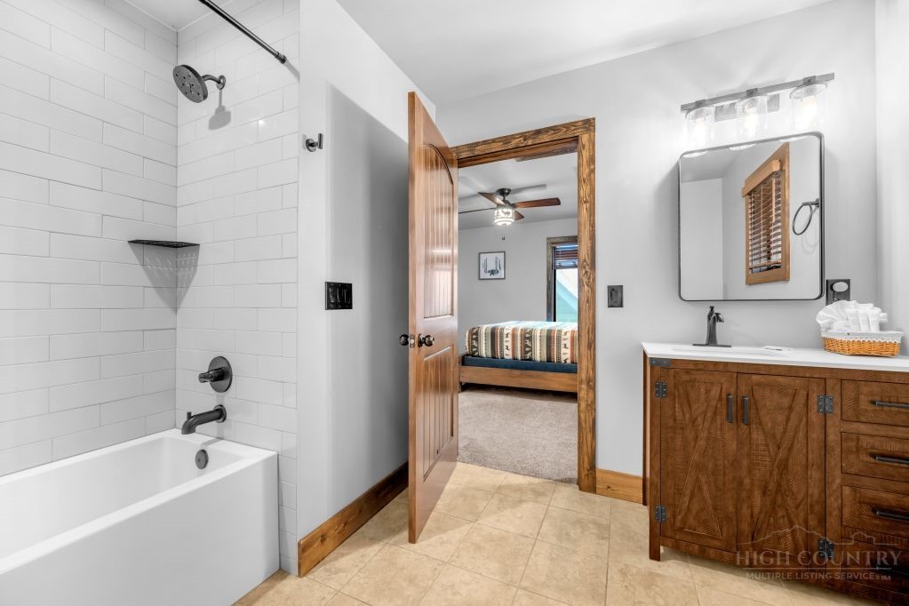 27 Timber Rock Trail Banner Elk, NC 28604 - Photo 32 of 50 a spacious bathroom with a tub sink and mirror