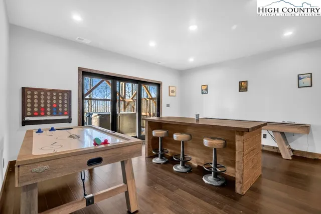 a living room filled with furniture and wooden floor
