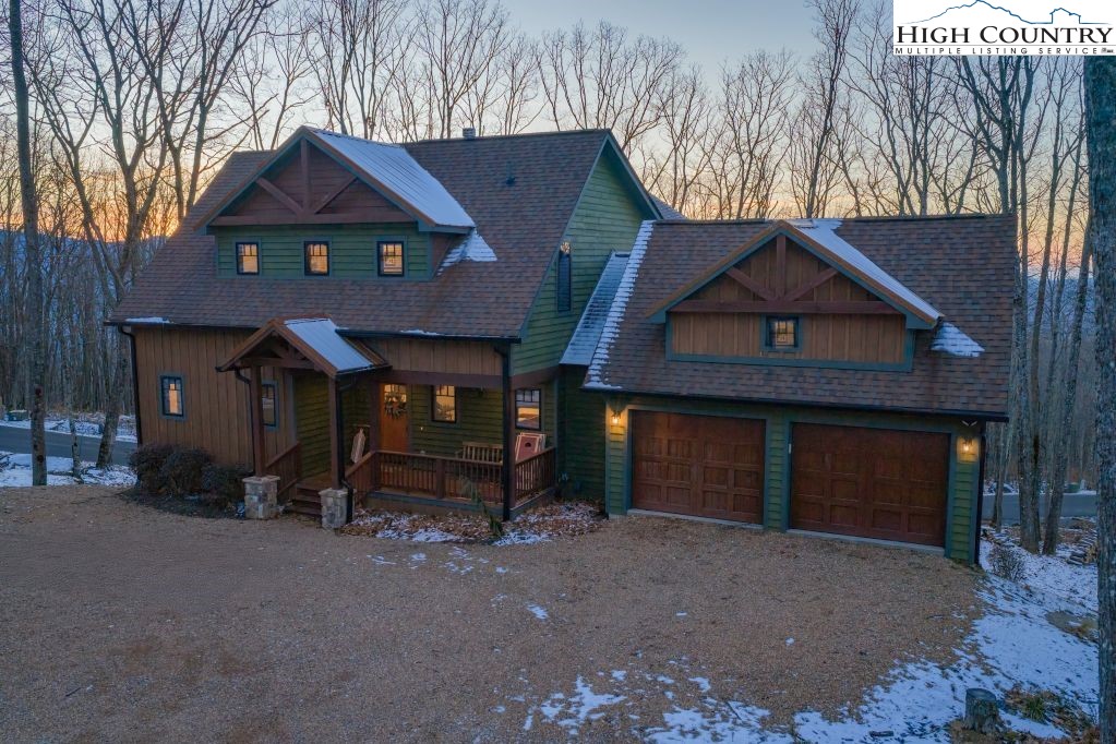 27 Timber Rock Trail Banner Elk, NC 28604 - Photo 40 of 45 a front view of a house with a yard and garage