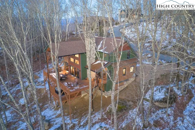 a view of a backyard with swimming pool