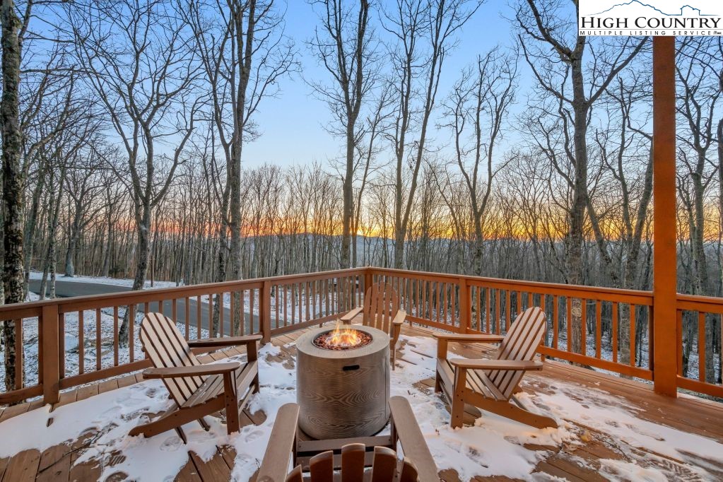 27 Timber Rock Trail Banner Elk, NC 28604 - Photo 5 of 45 a view of a chairs and table on the deck