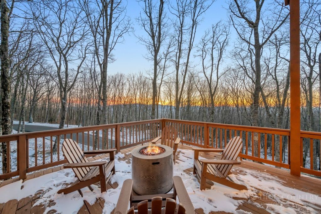 27 Timber Rock Trail Banner Elk, NC 28604 - Photo 6 of 50 a view of a chairs and table on the deck