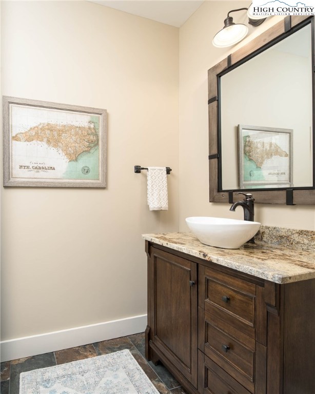 553 Marigold Road Boone, NC 28607 - Photo 15 of 48 a bathroom with a granite countertop sink and a mirror