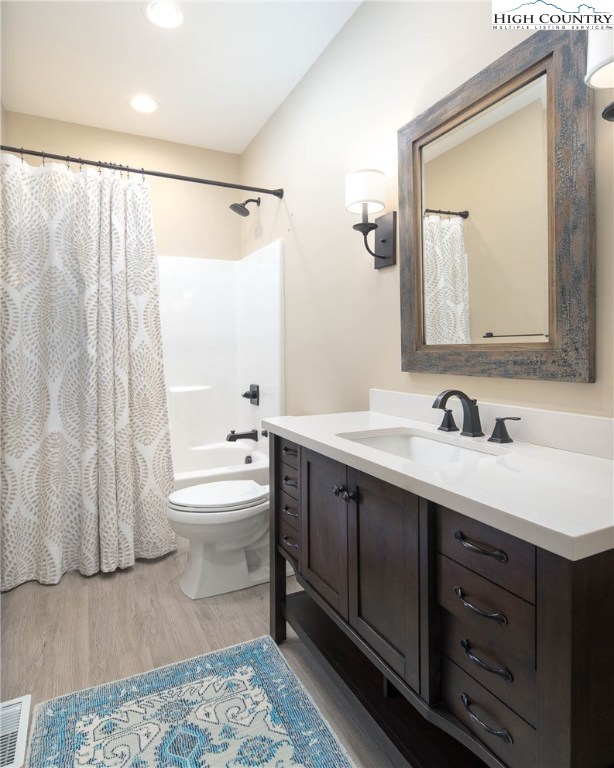 553 Marigold Road Boone, NC 28607 - Photo 18 of 48 a bathroom with a double vanity sink and mirror with bathtub