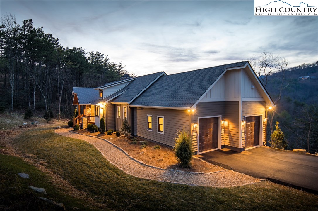 553 Marigold Road Boone, NC 28607 - Photo 20 of 48 a view of a house with backyard and porch