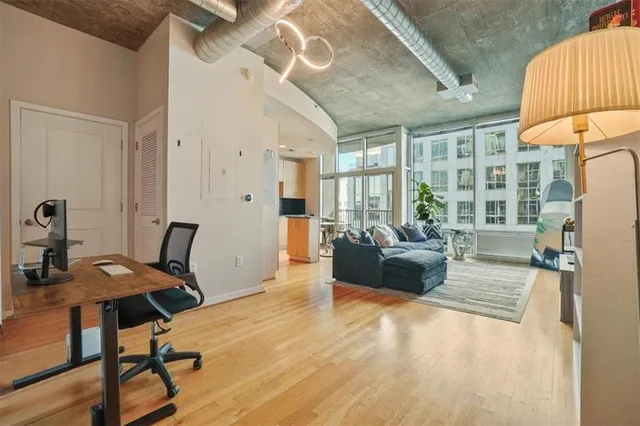 a kitchen with stainless steel appliances a stove top oven a sink and a refrigerator