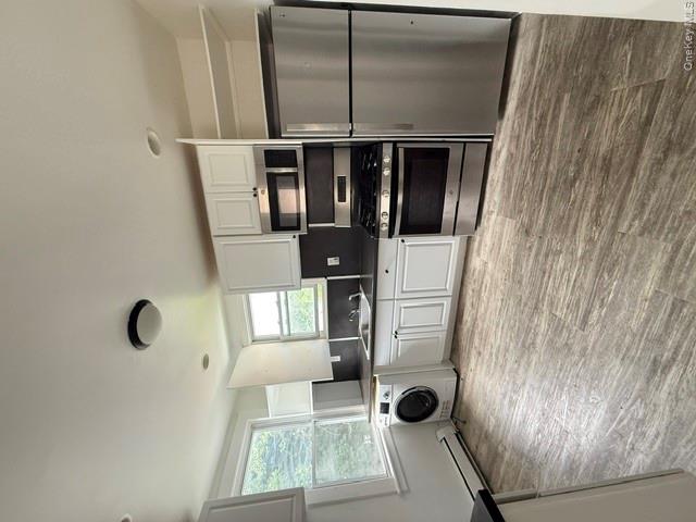 72 Chauncey Avenue New Rochelle, NY 10801 - Photo 11 of 14 a kitchen with a refrigerator and a microwave