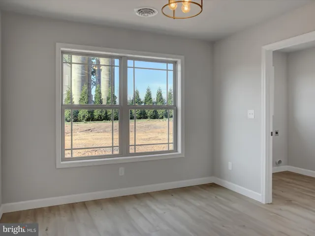 a kitchen with a refrigerator a sink and cabinets