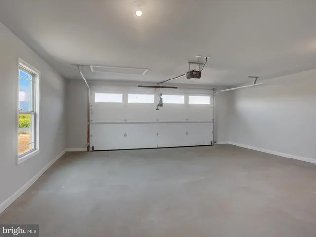 a bathroom with a bathtub shower sink vanity and toilet