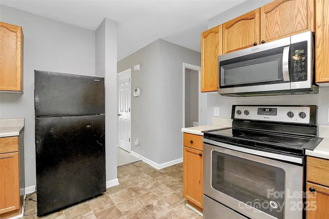 a kitchen with a stove and a microwave