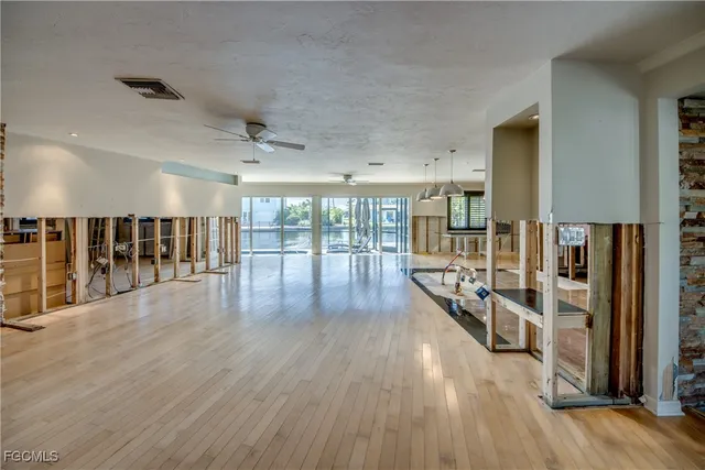 a view of a hall with wooden floor