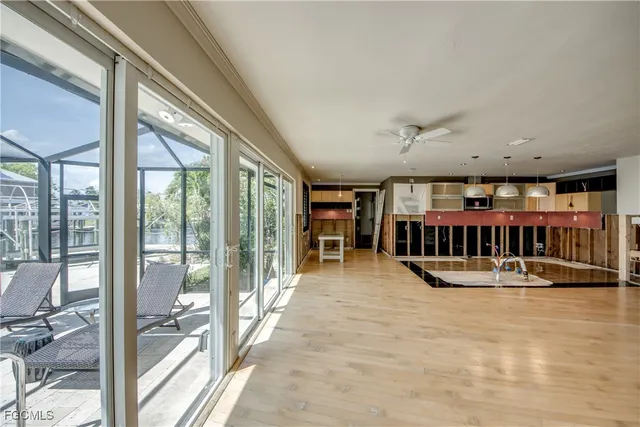 a view of a living room and balcony