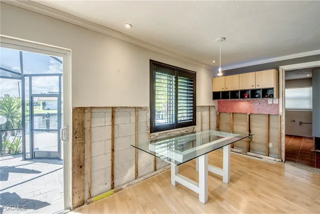 a view of a room with furniture and window