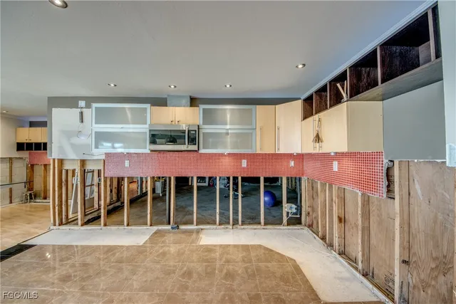 a very nice looking room with a large window and furniture