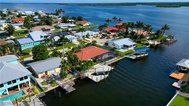 an aerial view of a house yard swimming pool and outdoor seating