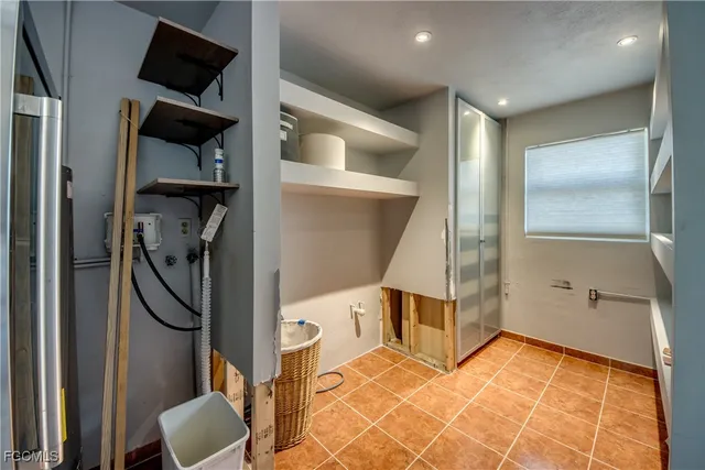 a patio with yard glass top table and chairs