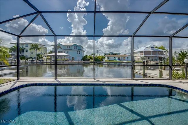 a view of yard with swimming pool and sitting area