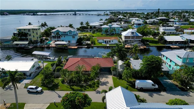 a aerial view of a house with garden space and lake view