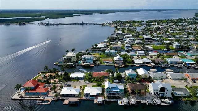 an aerial view of a houses with sitting area