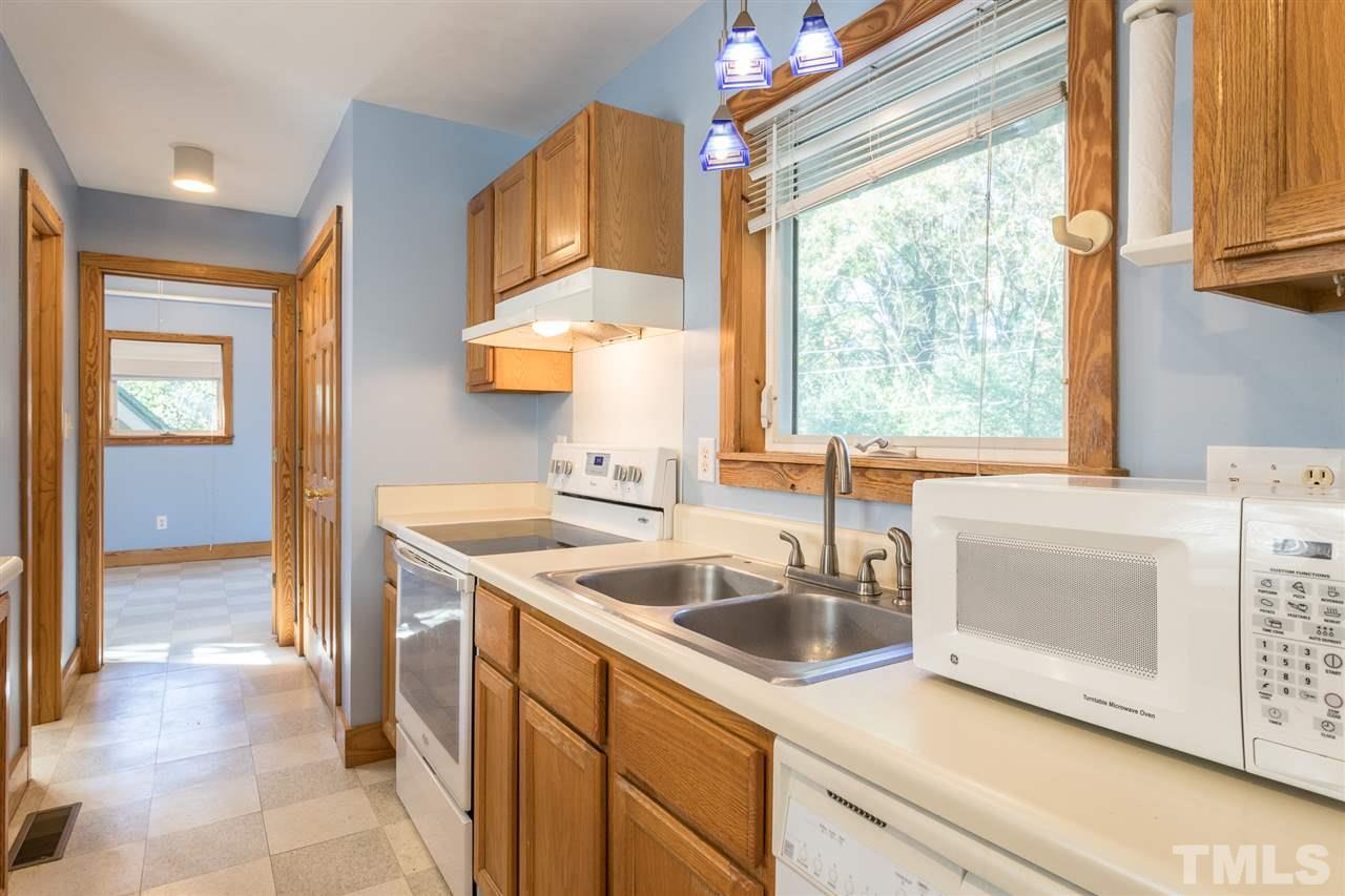 700 Method Road Raleigh, NC 27607 - Photo 14 of 29 a kitchen with a sink cabinets and window