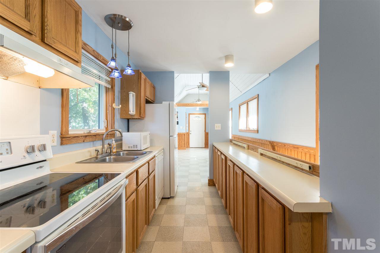 700 Method Road Raleigh, NC 27607 - Photo 15 of 29 a kitchen with a sink stove and cabinets