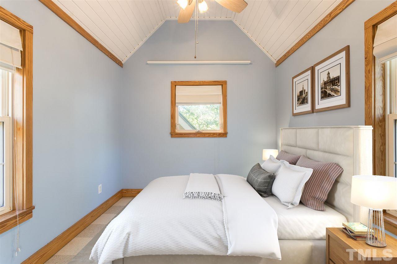 700 Method Road Raleigh, NC 27607 - Photo 16 of 29 a bedroom with a bed and a window