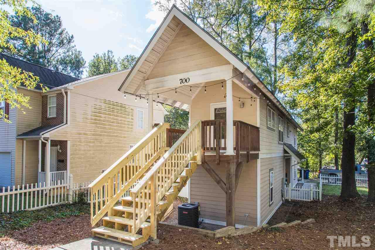 700 Method Road Raleigh, NC 27607 - Photo 3 of 29 a view of a house with wooden deck and a large tree