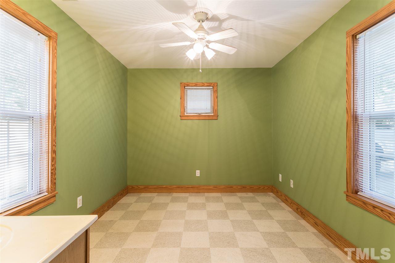 700 Method Road Raleigh, NC 27607 - Photo 24 of 29 a view of a room with a window and a chandelier fan