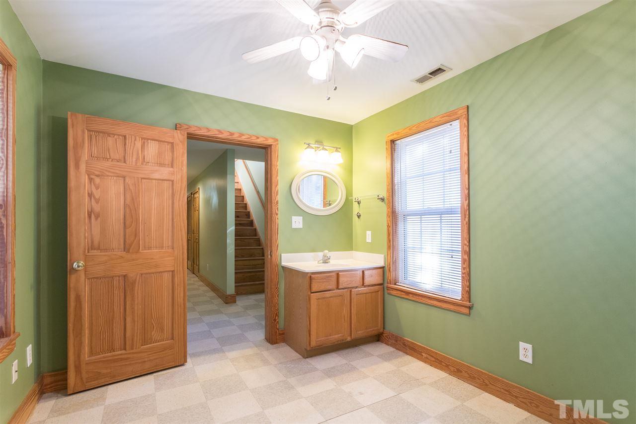 700 Method Road Raleigh, NC 27607 - Photo 25 of 29 a room with window and a chandelier fan
