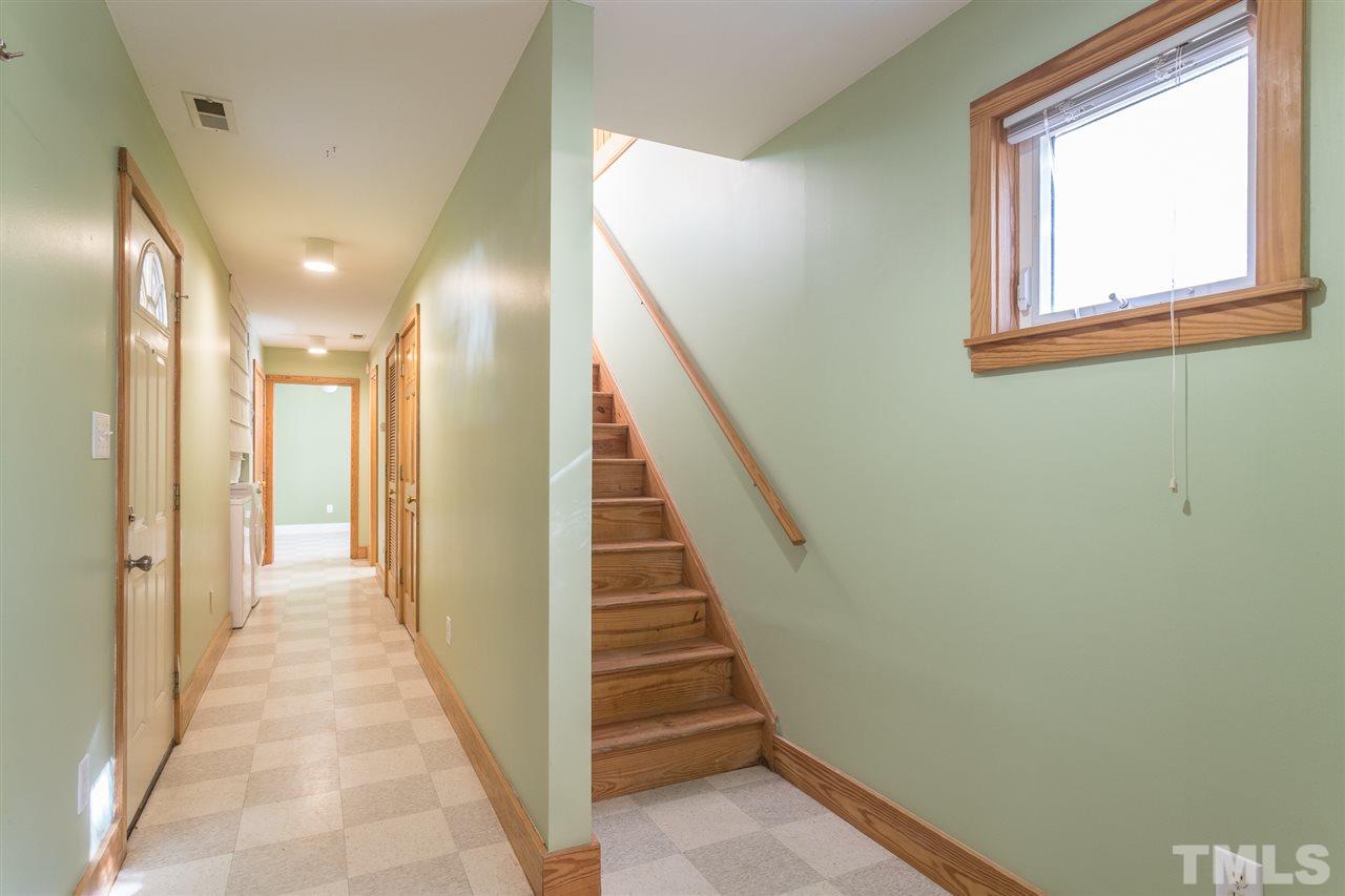 700 Method Road Raleigh, NC 27607 - Photo 27 of 29 a view of a hallway with wooden floor and entryway