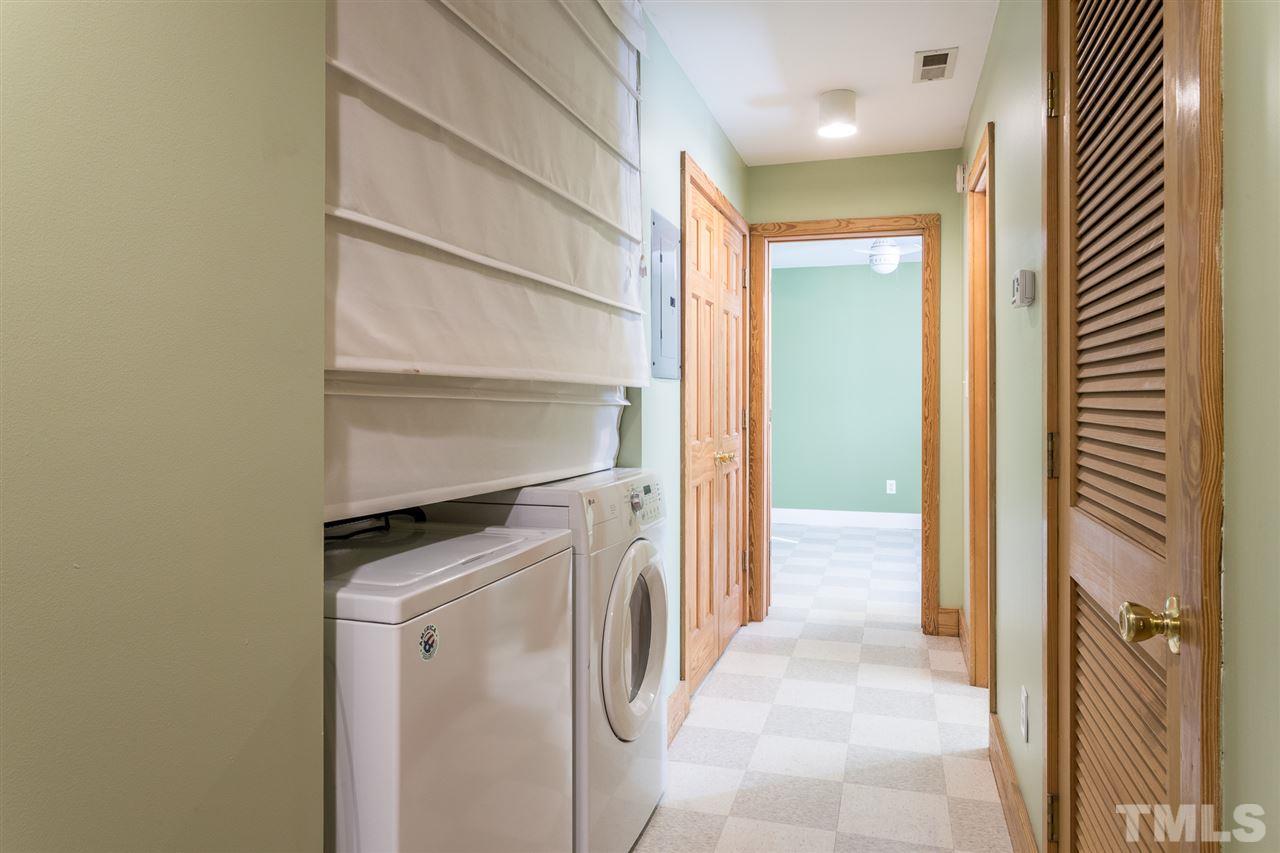 700 Method Road Raleigh, NC 27607 - Photo 28 of 29 a view of a hallway with washer and dryer