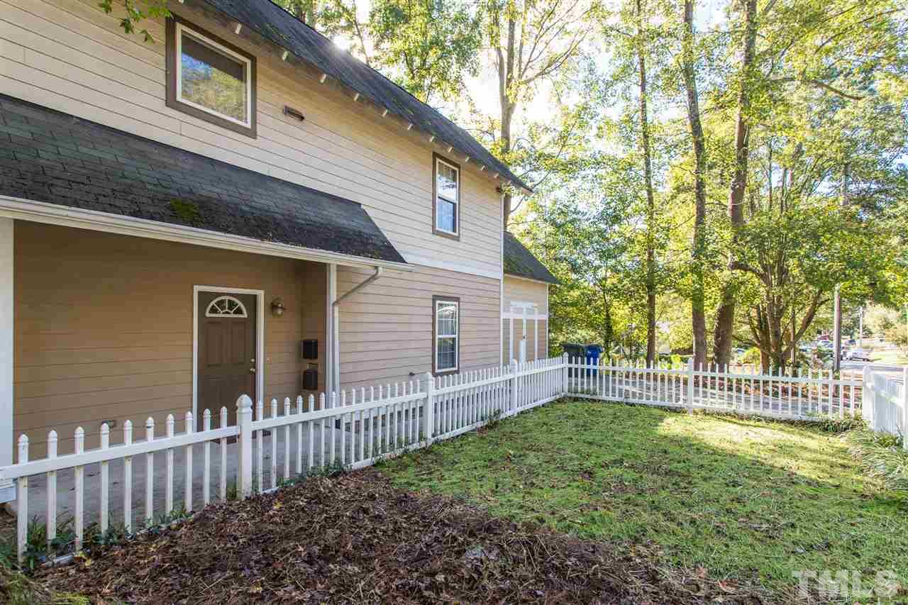 700 Method Road Raleigh, NC 27607 - Photo 6 of 29 a front view of a house with a yard