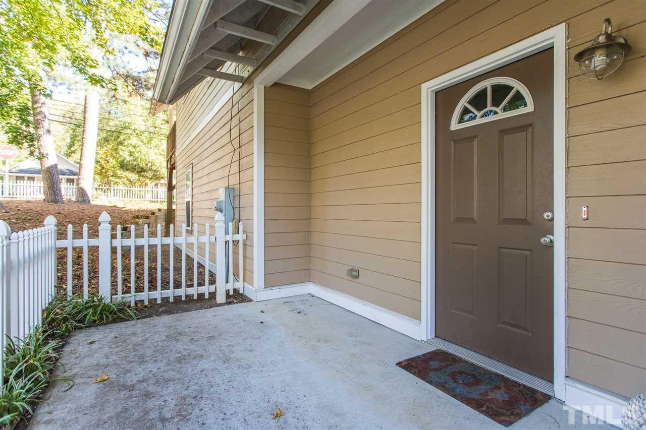 700 Method Road Raleigh, NC 27607 - Photo 7 of 29 a view of a door with a door and wooden walls