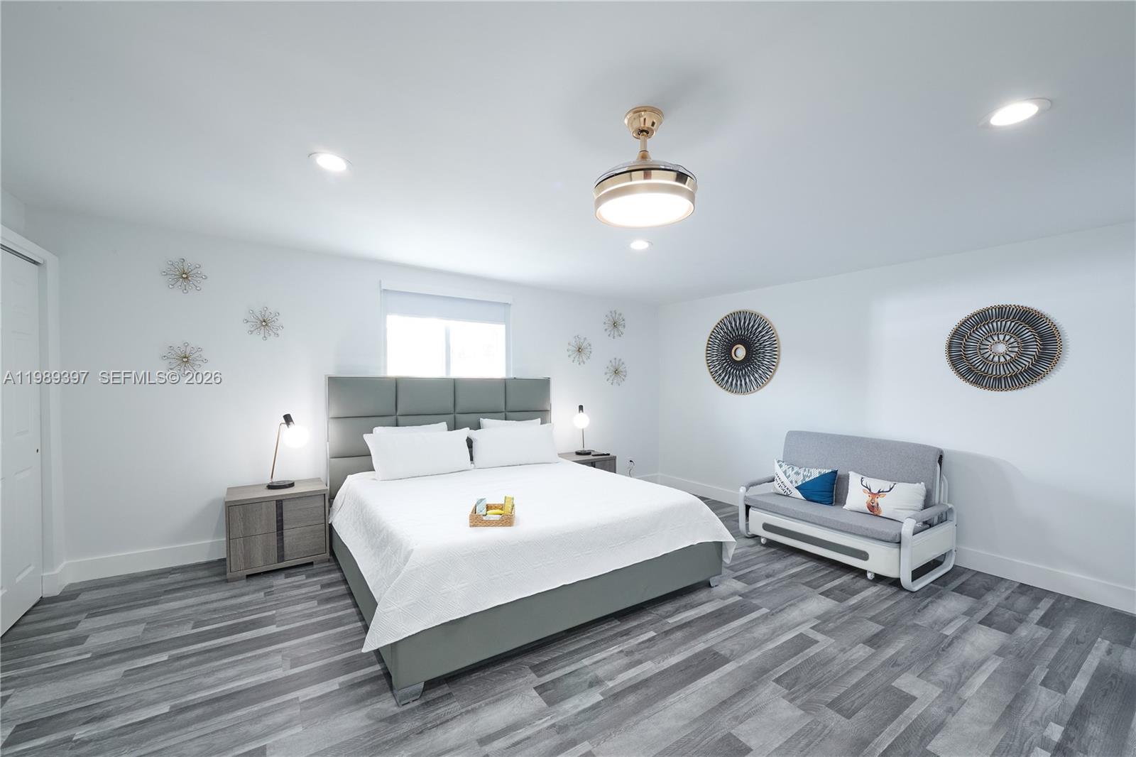 12293 Southwest 28th Terrace Miami, FL 33175 - Photo 12 of 25 a spacious bedroom with a bed and a window