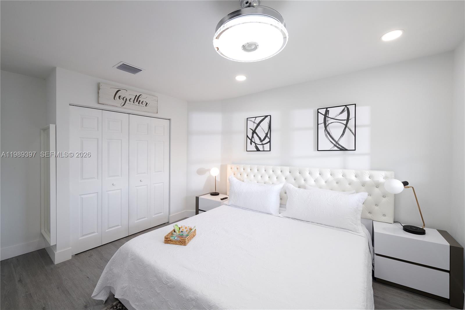 12293 Southwest 28th Terrace Miami, FL 33175 - Photo 13 of 25 a bedroom with a bed and a couch