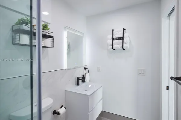 a bathroom with a sink and mirror