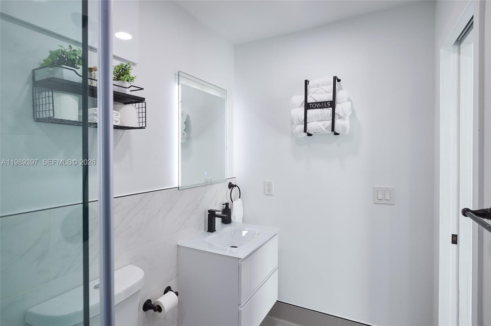 12293 Southwest 28th Terrace Miami, FL 33175 - Photo 14 of 25 a bathroom with a sink and mirror