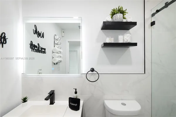 a bathroom with a sink and mirror